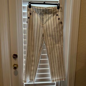 Kate Park strips pants with two buckets and 3 buttons on each pocket